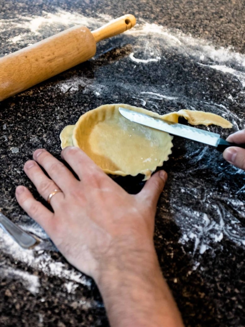 cutting excess dough