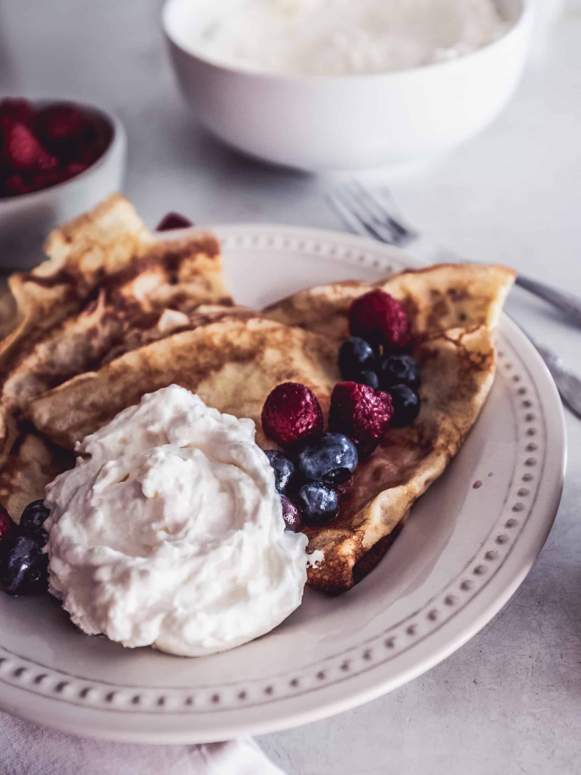 blini with berries and homemade cream
