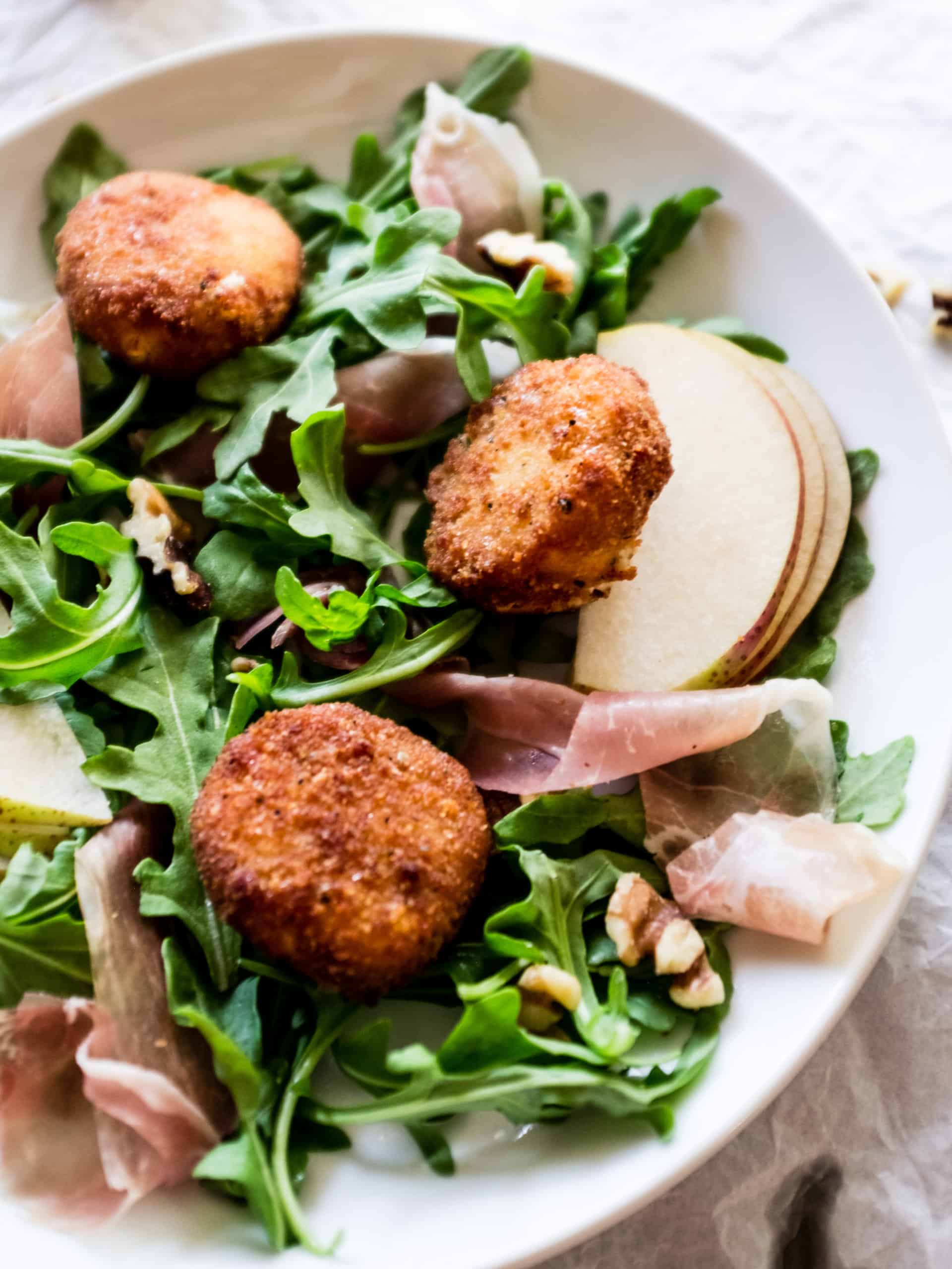 fried goat cheese on top of salad
