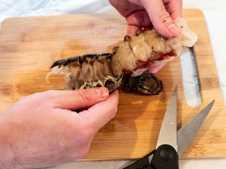 lifting lobster tail out of the shell
