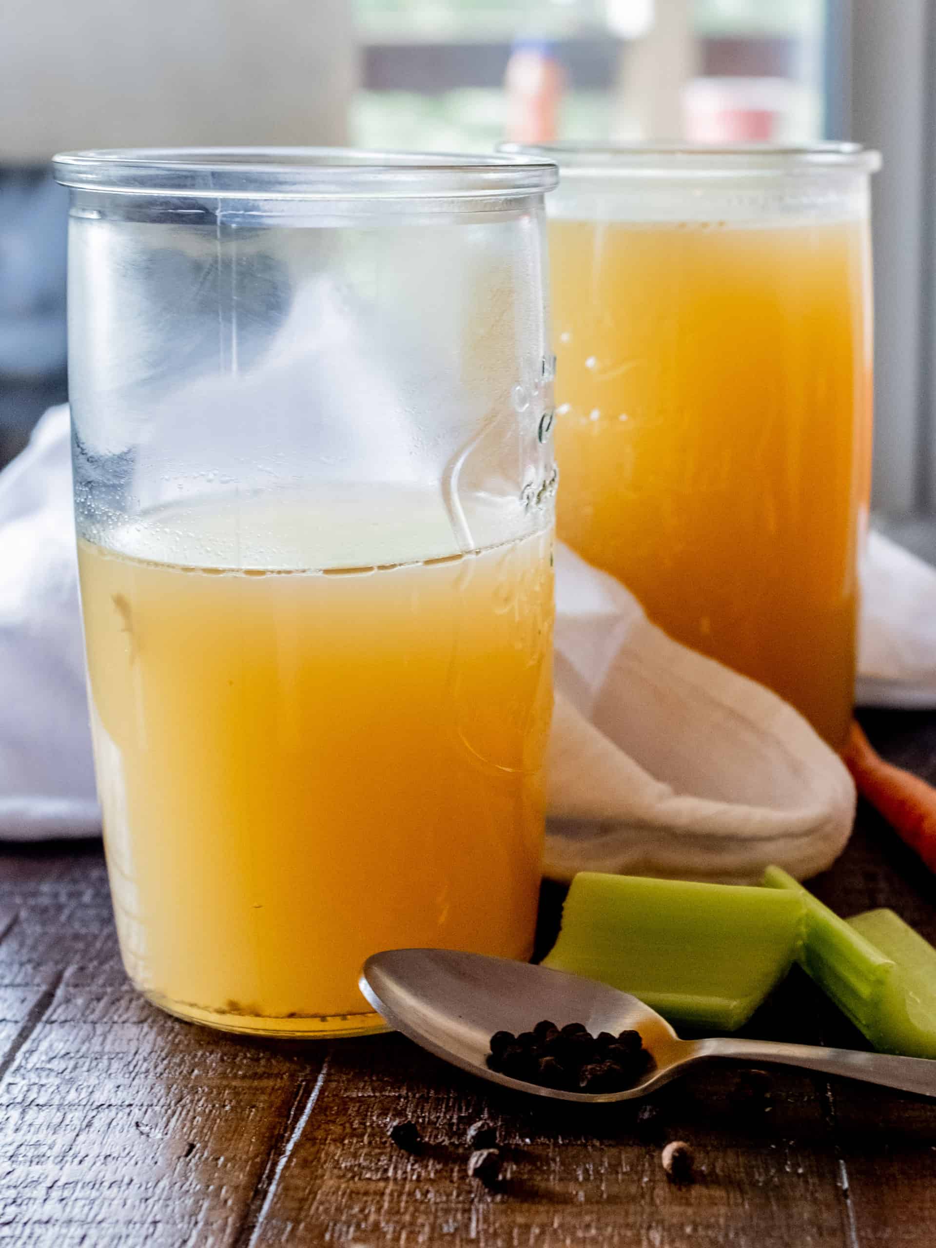 homemade chicken stock in containers