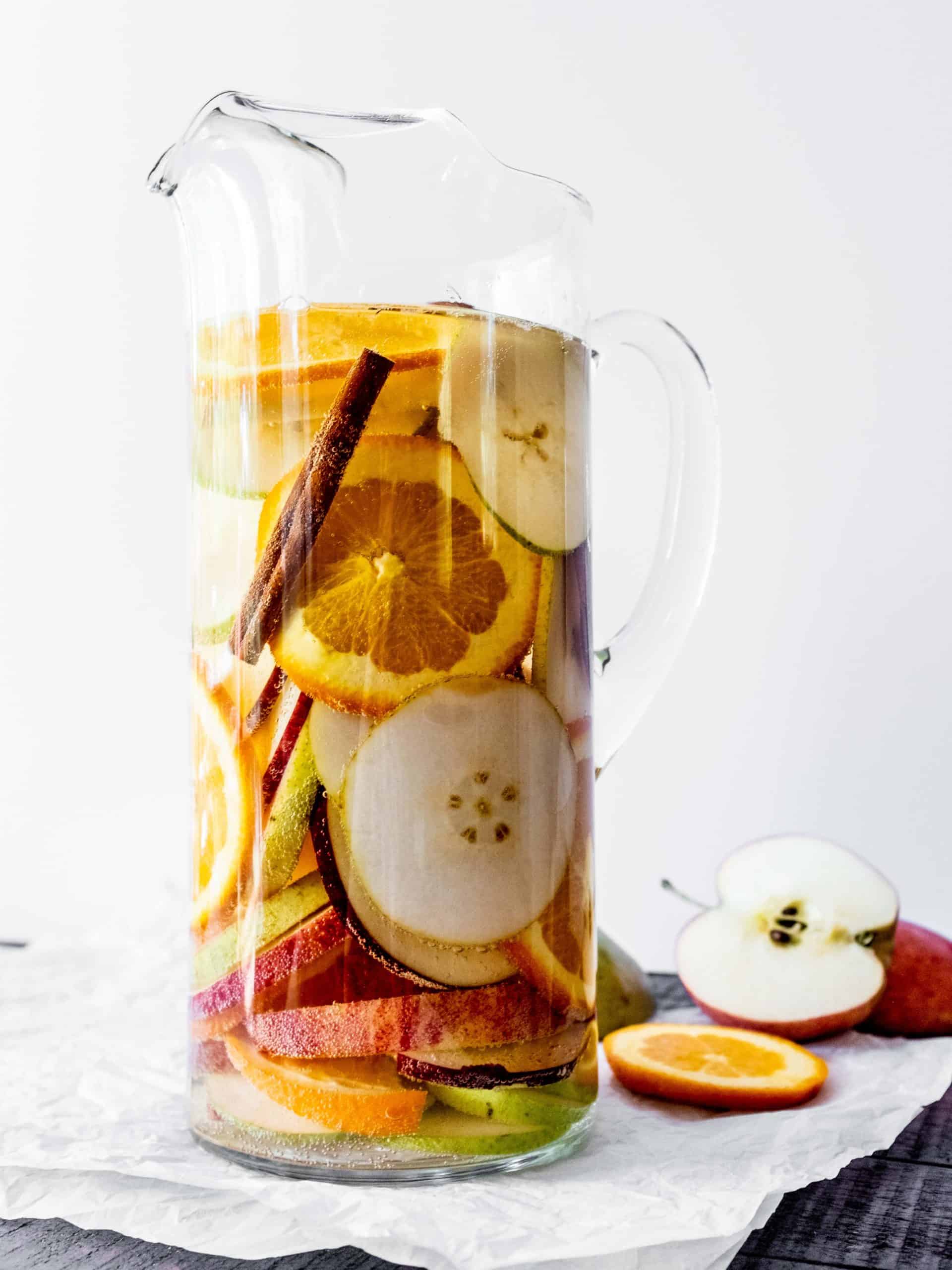 pitcher with white sangria and apples