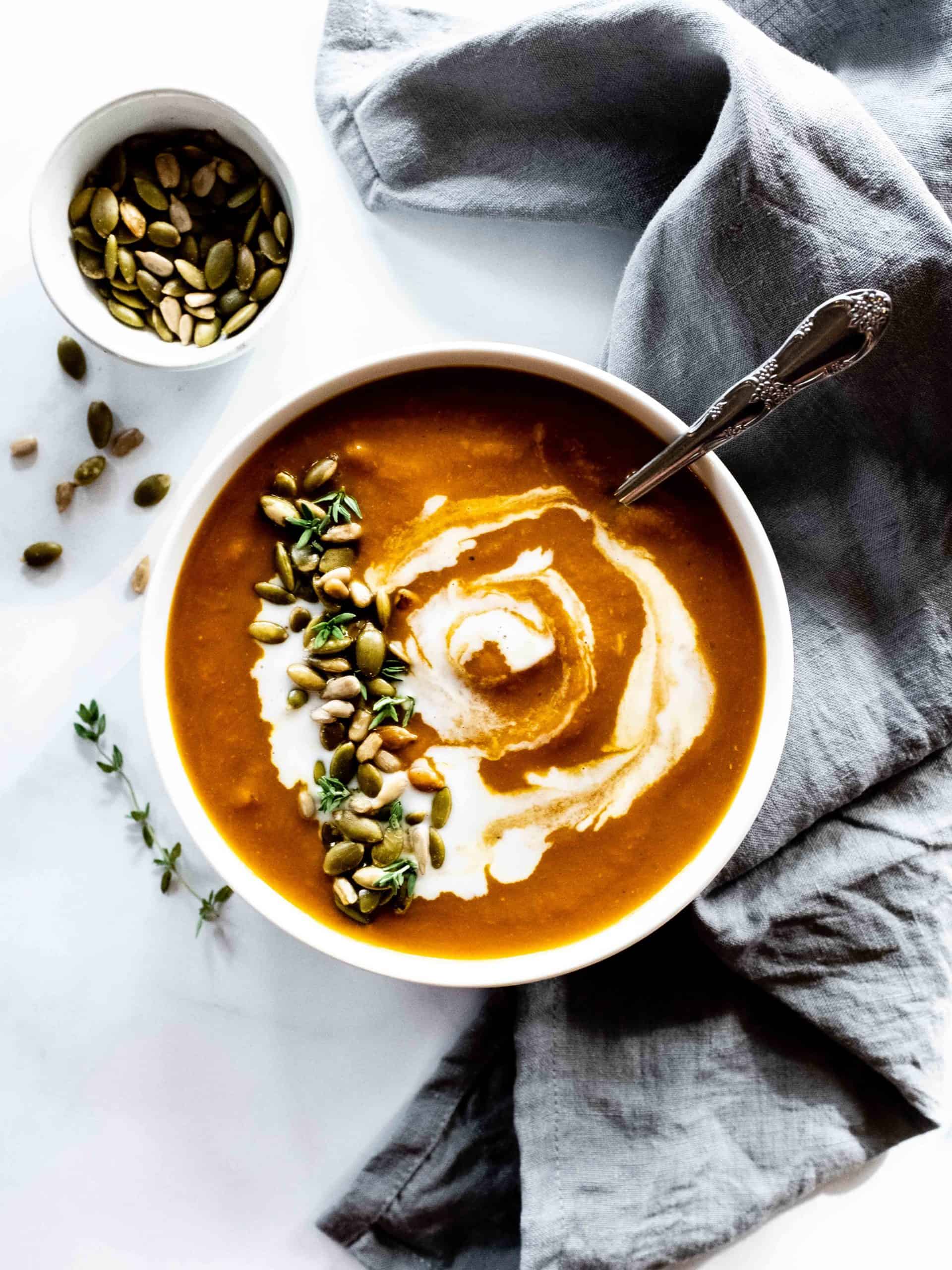 pumpkin turmeric soup with spoon