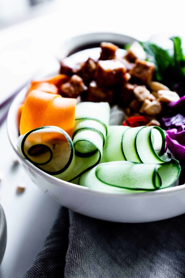 carrots and cucumbers in noodle bowl