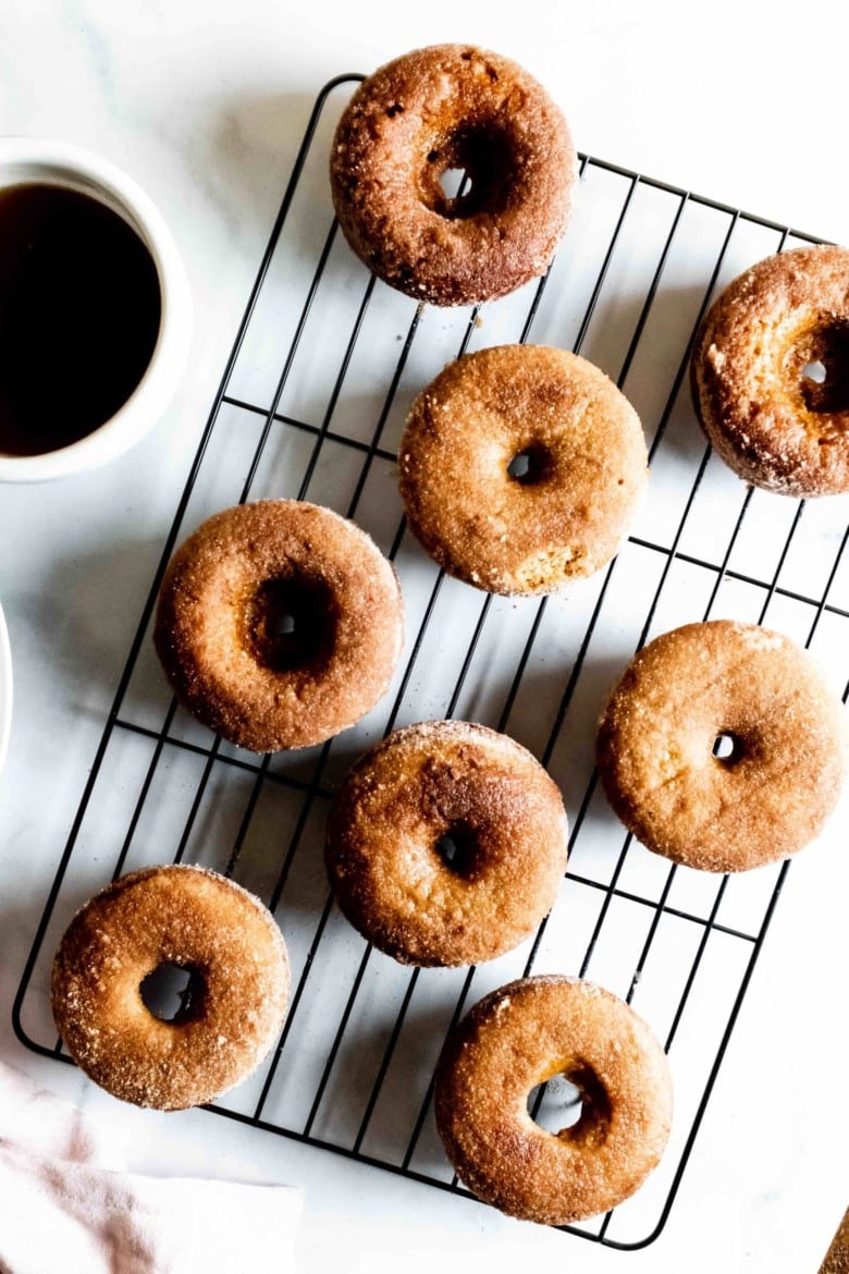donuts with cinnamon sugar on a rack