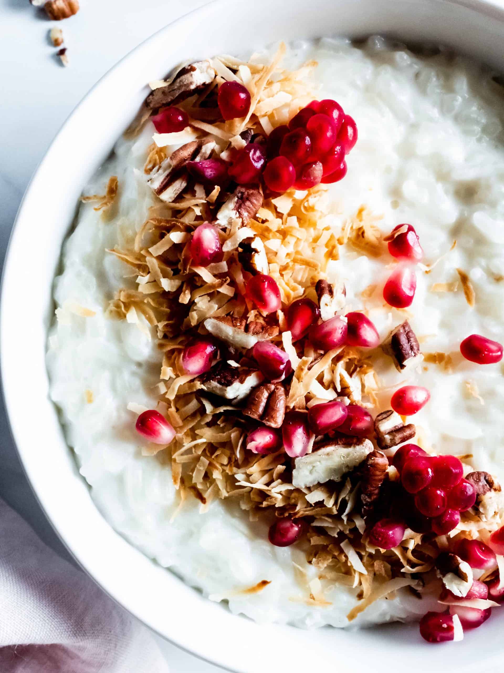 close up of pomegranate topping on rice porridge