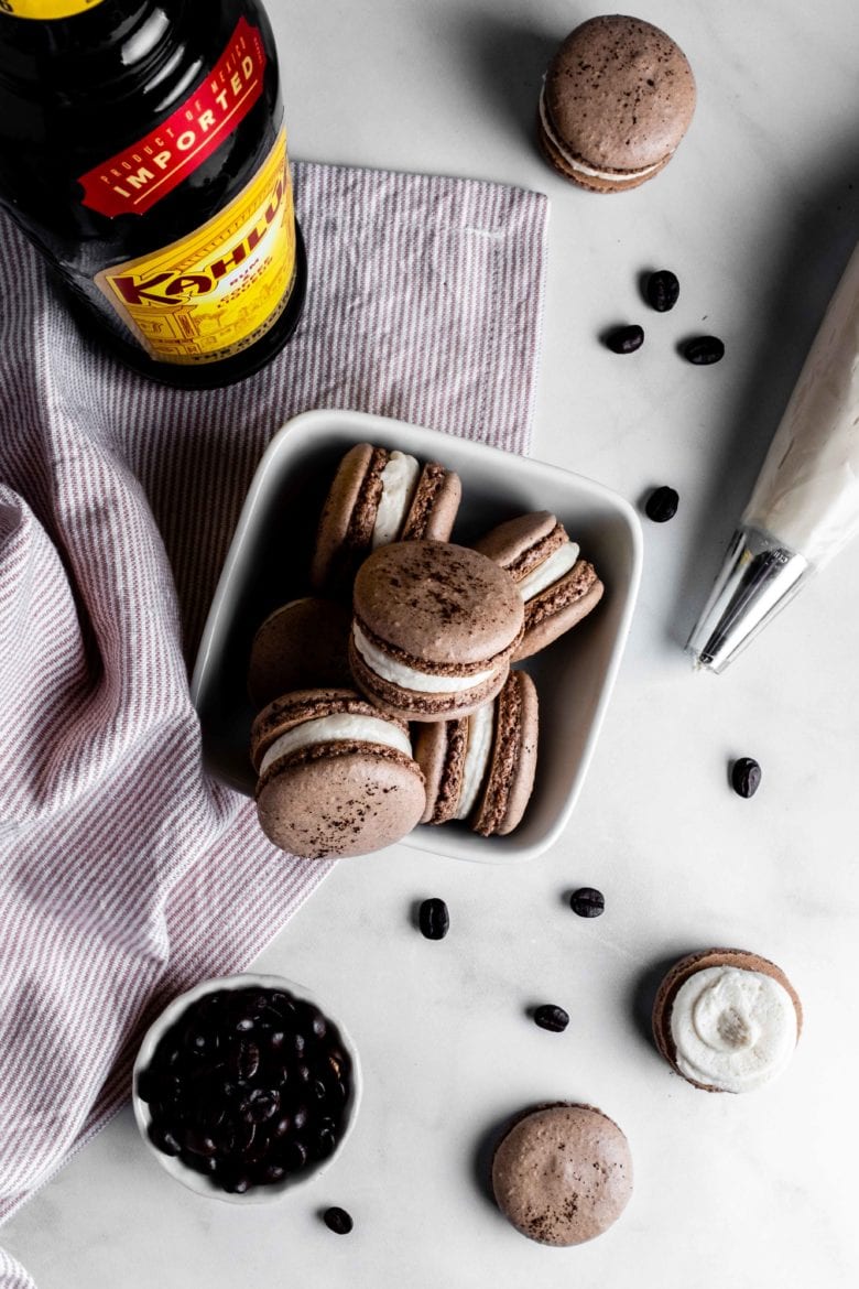 bottle of kahlua with chocolate macarons