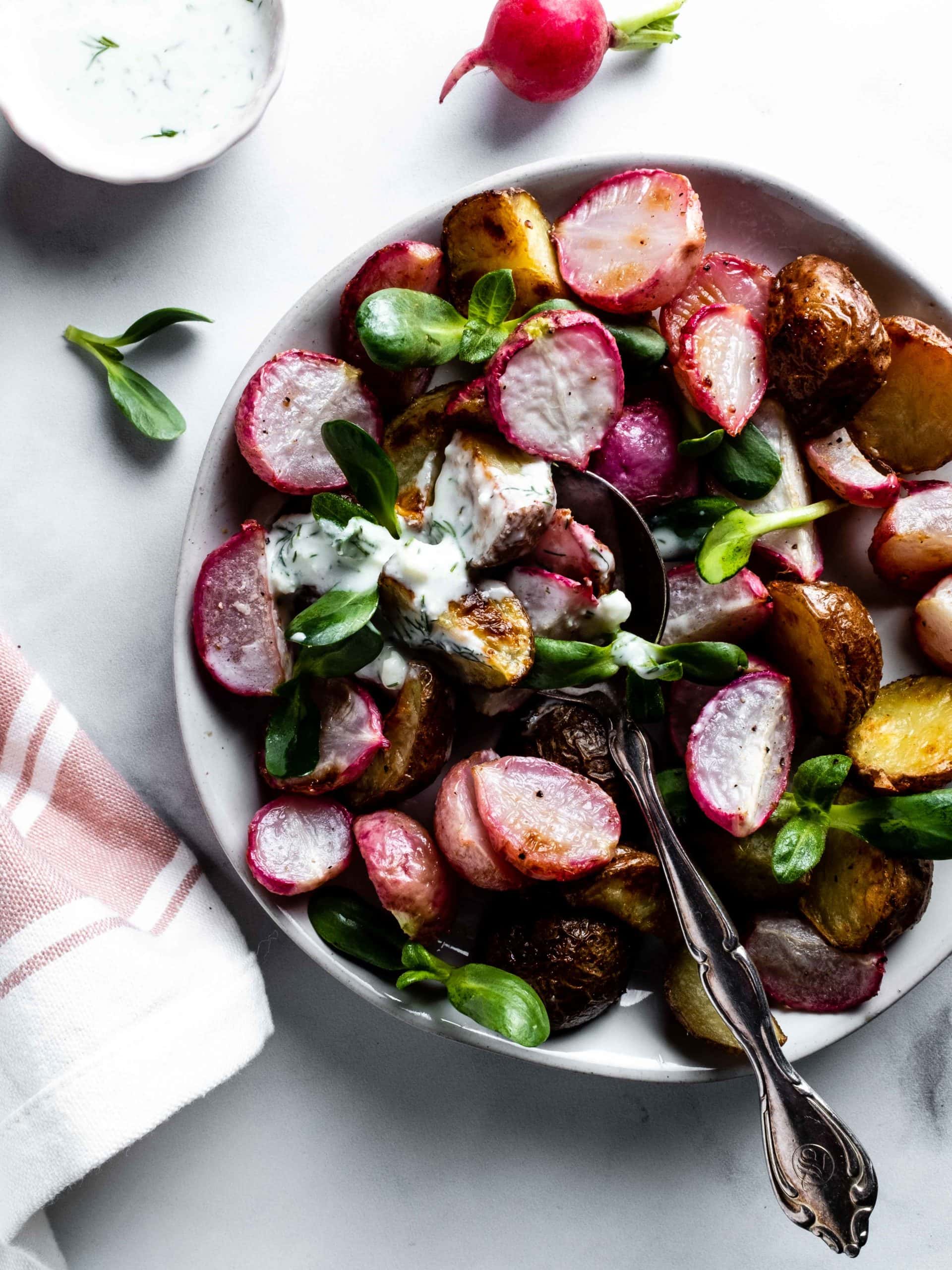 roasted radishes and potatoes topped with feta kefir dressing