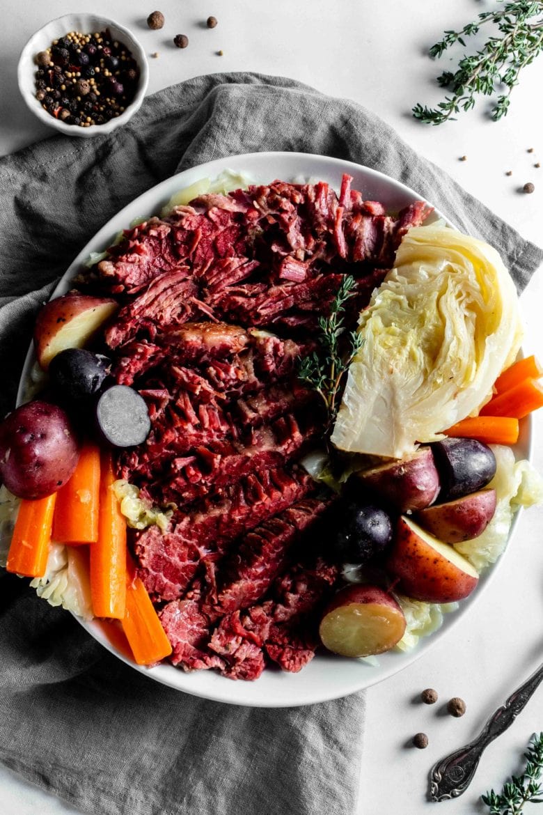 plate of corned beef with cabbage, carrots and potatoes