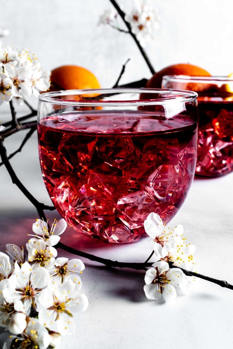 orange infused wine with ice and small flowers