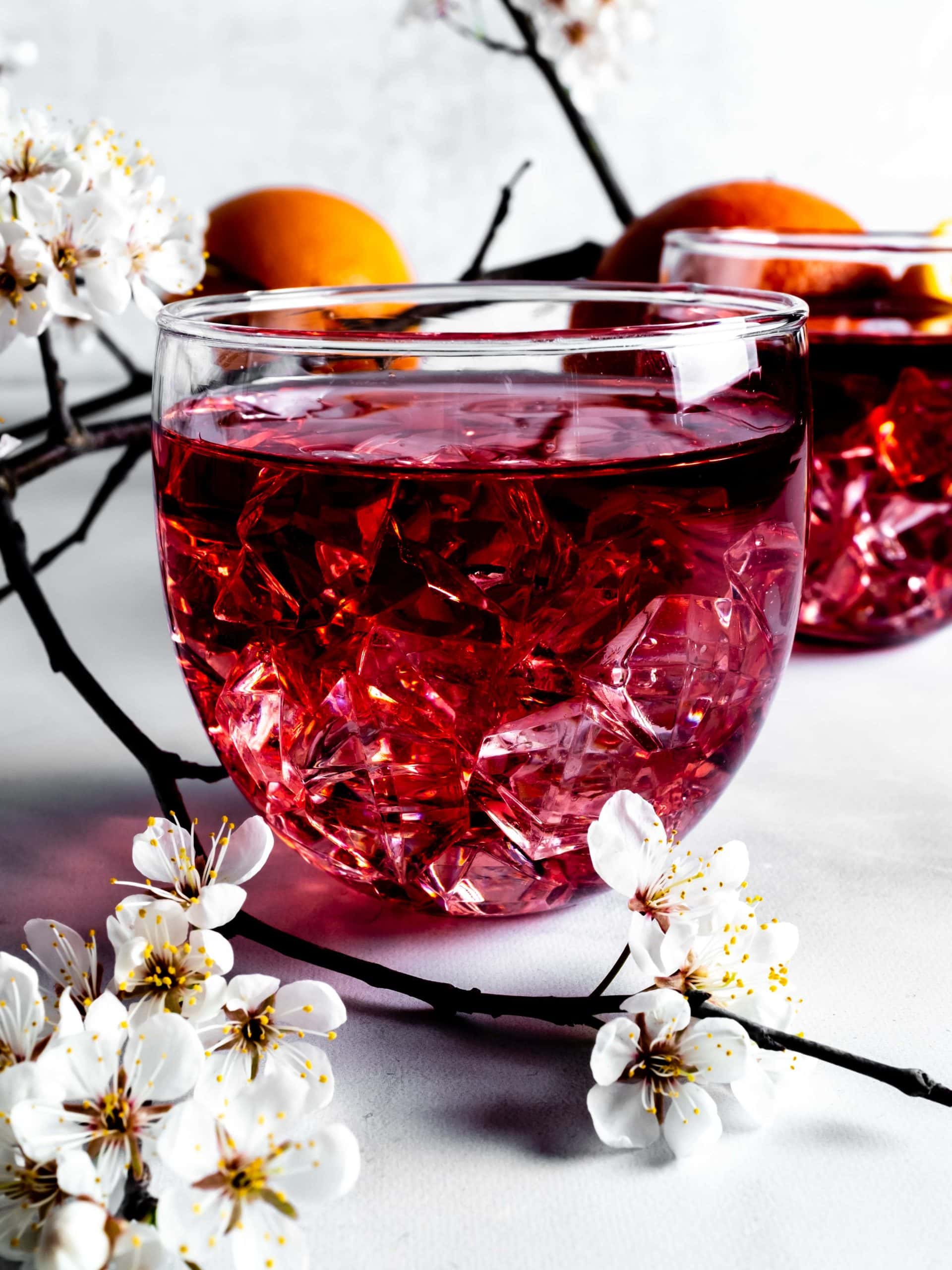 orange infused wine with ice and small flowers