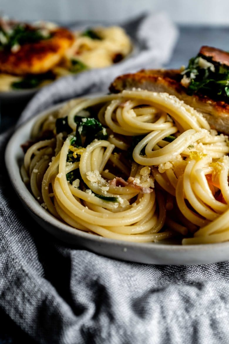 close up of lemon arugula pasta with parmesan