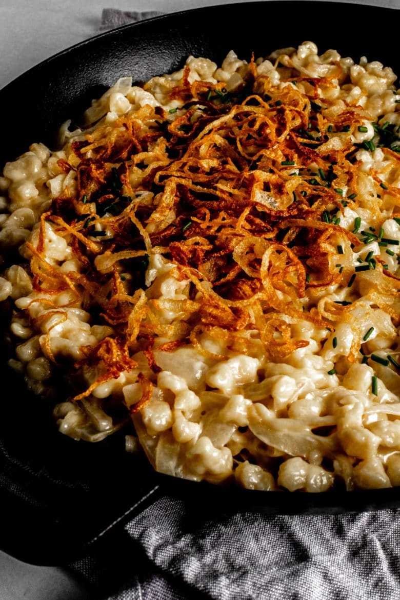 close up of käsespätzle with fried onions