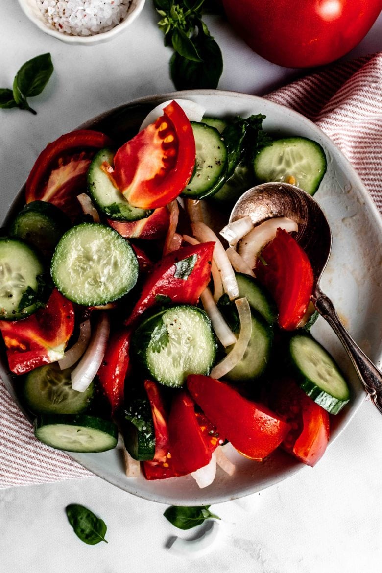 cucumber tomato salad with spoon