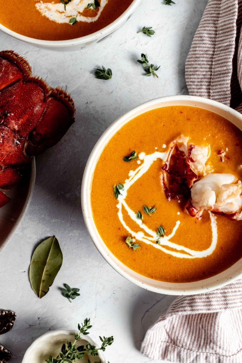 bowl of lobster bisque with pieces of lobster meat