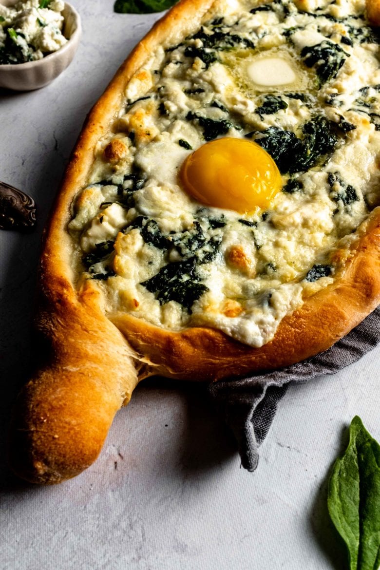 baked khachapuri with cheese, yolk and butter