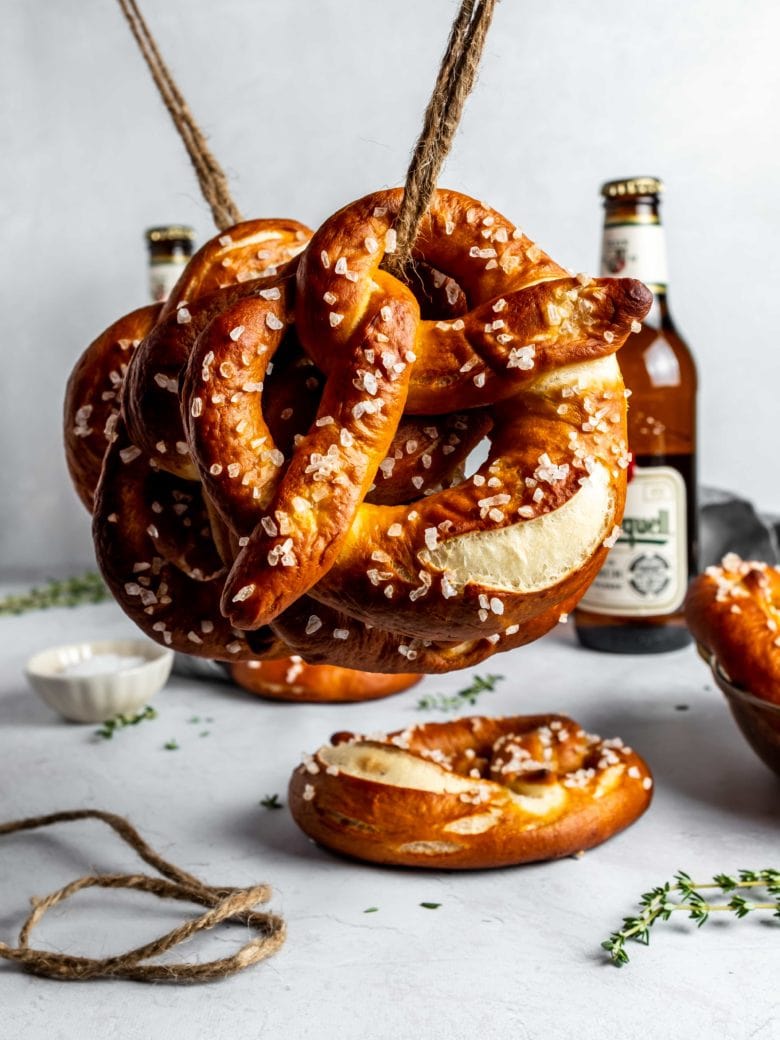 soft pretzels hanging on rope