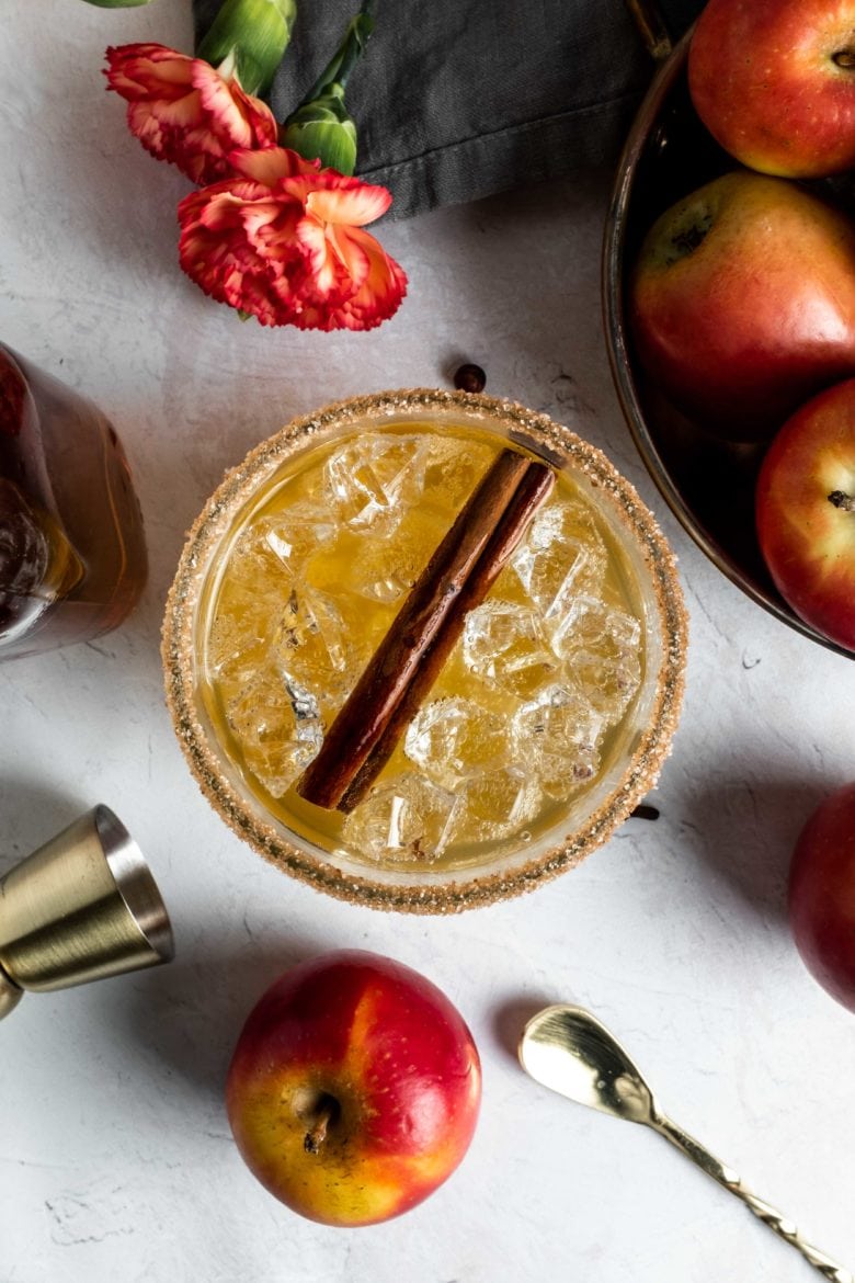 overhead view of harvest moon cocktail with cinnamon stick