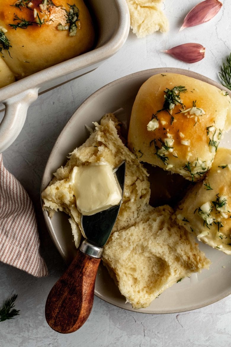 pampushky on a plate with butter