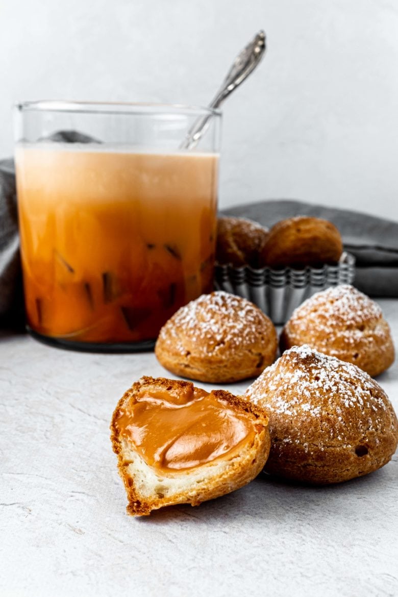 open cream puff with thai tea pastry cream