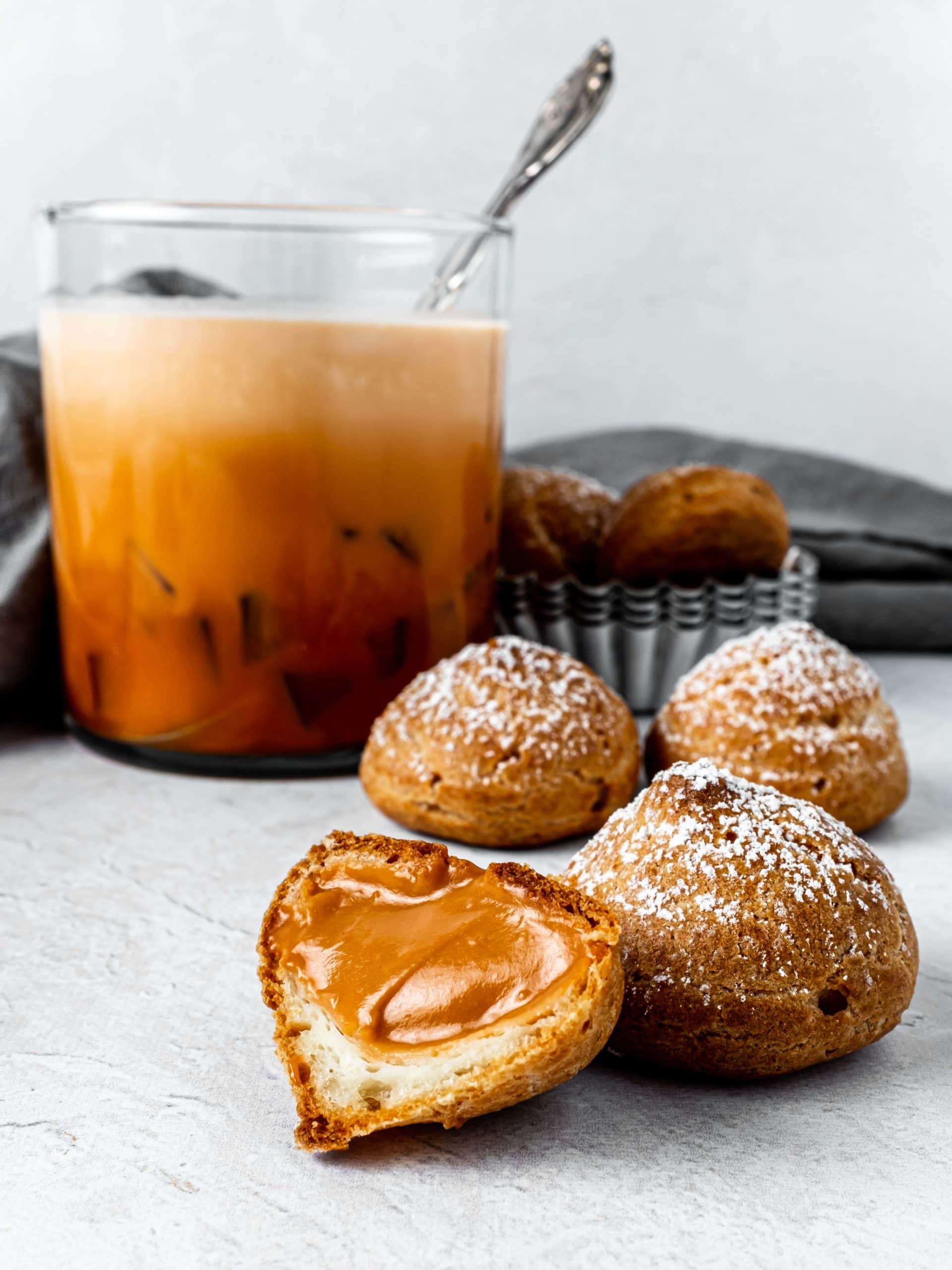 open cream puff with thai tea pastry cream