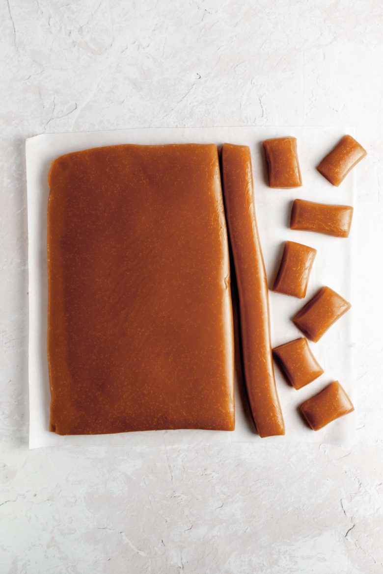 cutting soft caramels into individual pieces