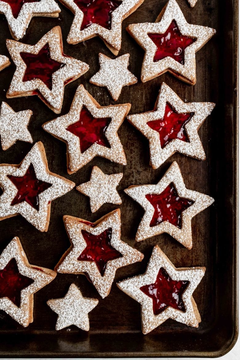 star shaped cookies with homemade glühwein jelly on pan
