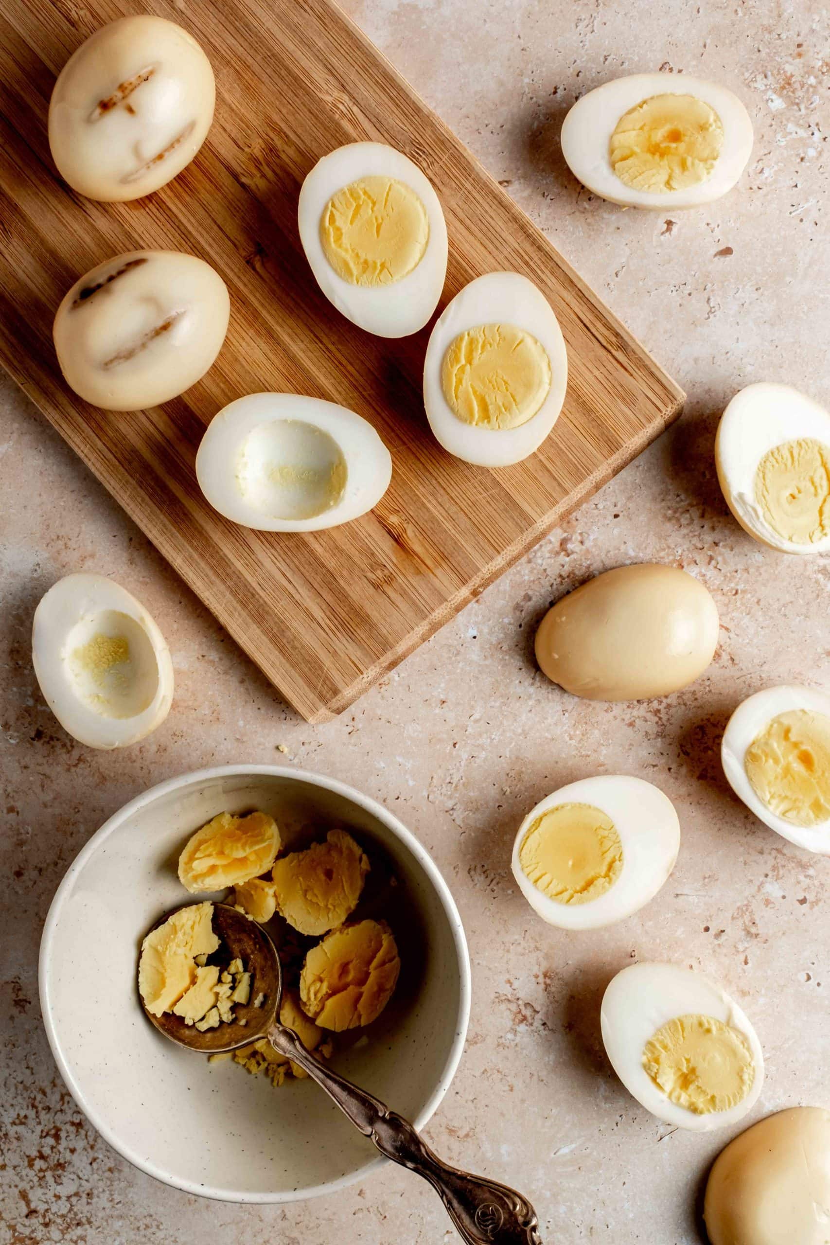 removing the yolks from the hard-boiled eggs