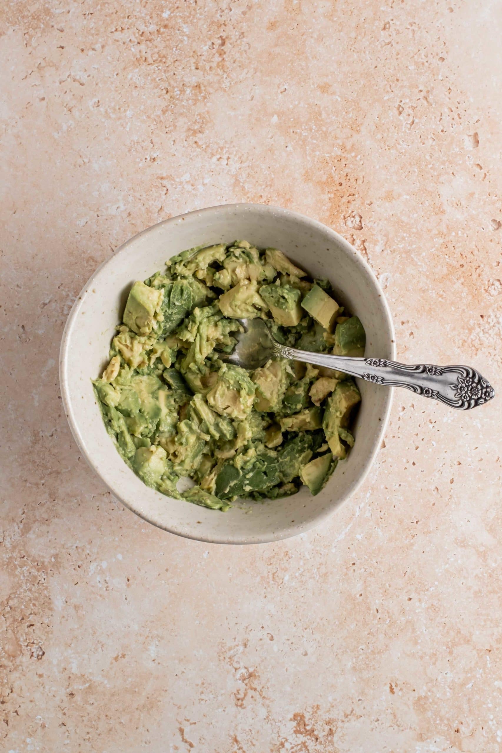 avocados mashed with fork