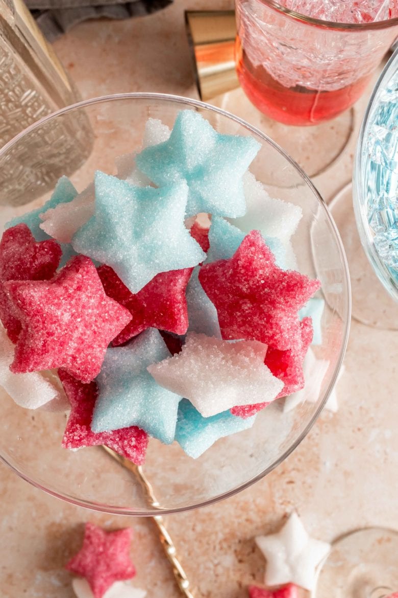 glass full of fourth of july themed sugar cubes