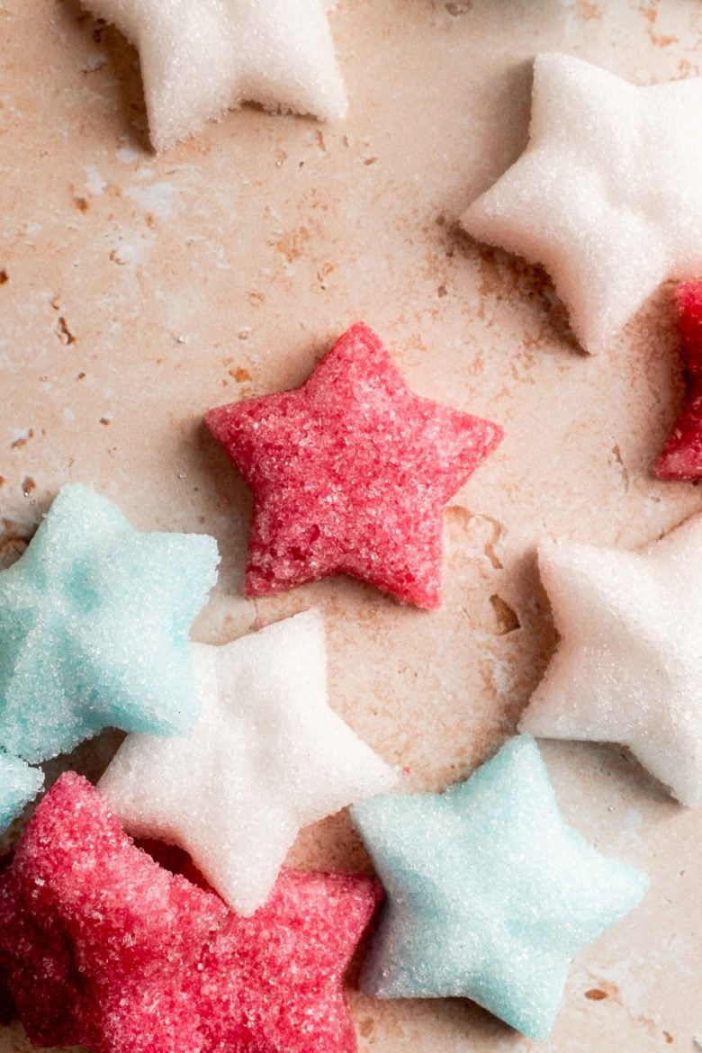 close up of red, white and blue star-shaped sugar cubes