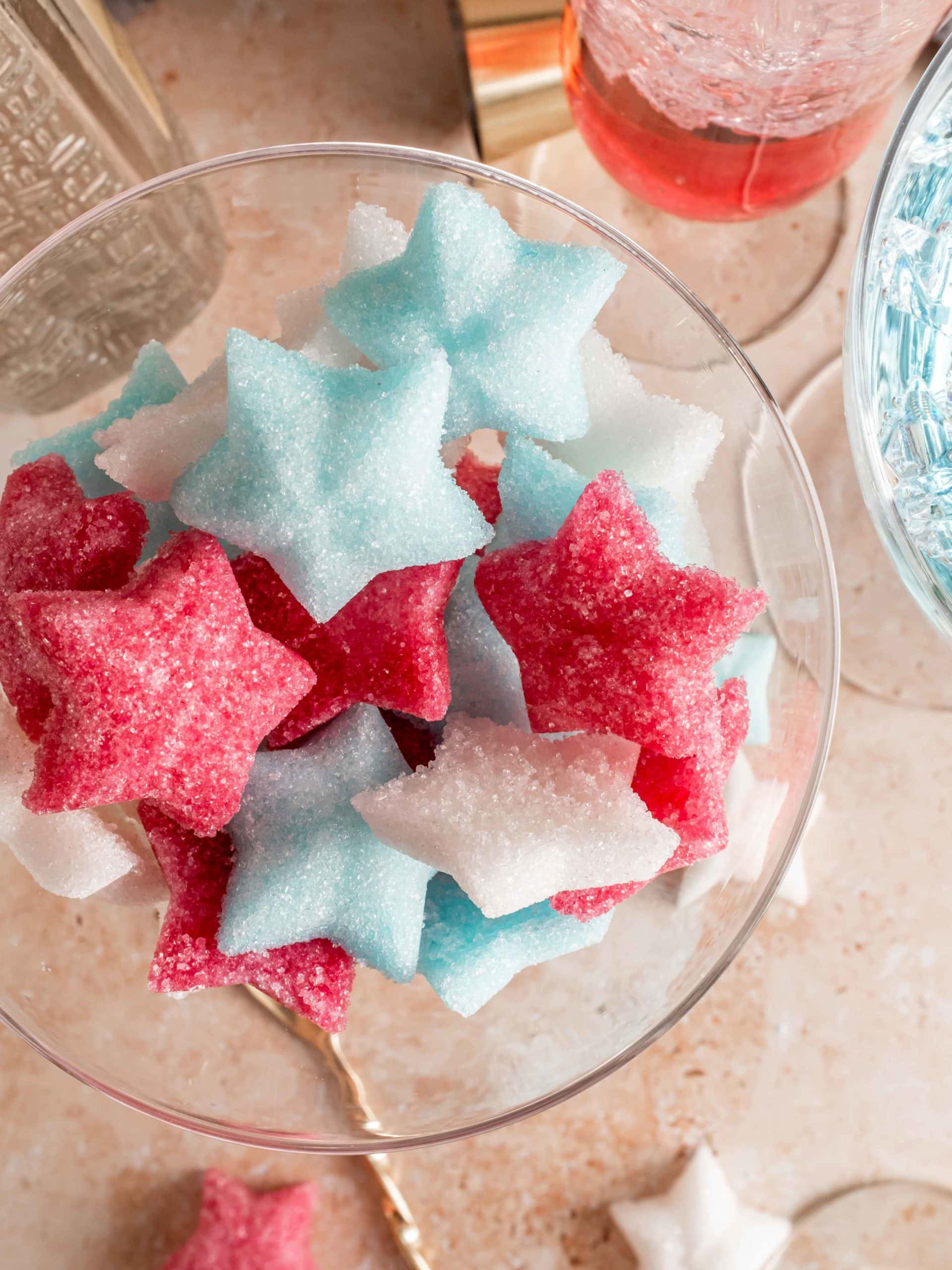 glass full of fourth of july themed sugar cubes