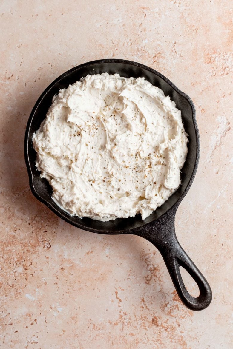 cast iron skillet with goat cheese dip