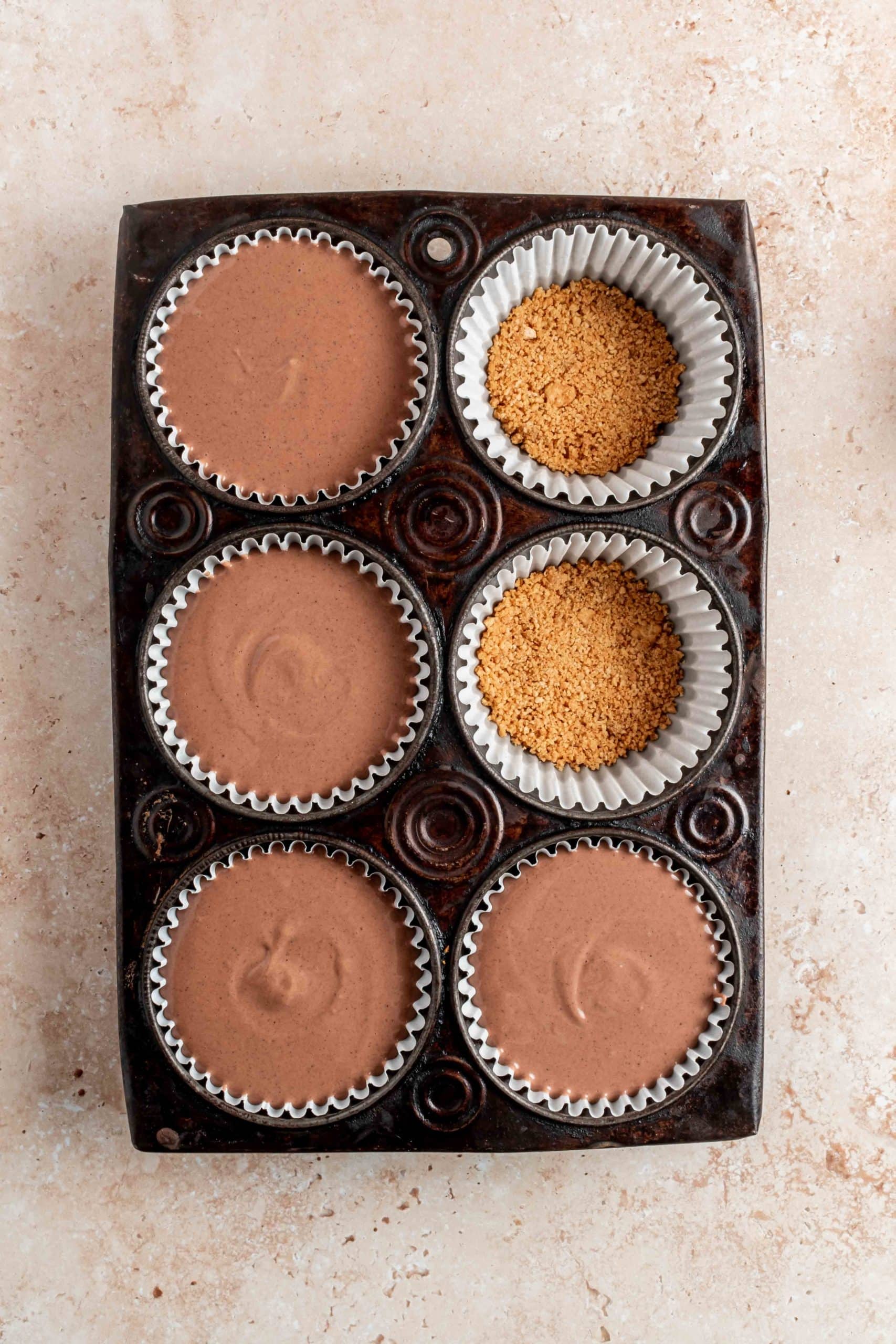 unbaked cheesecakes in cupcake tin