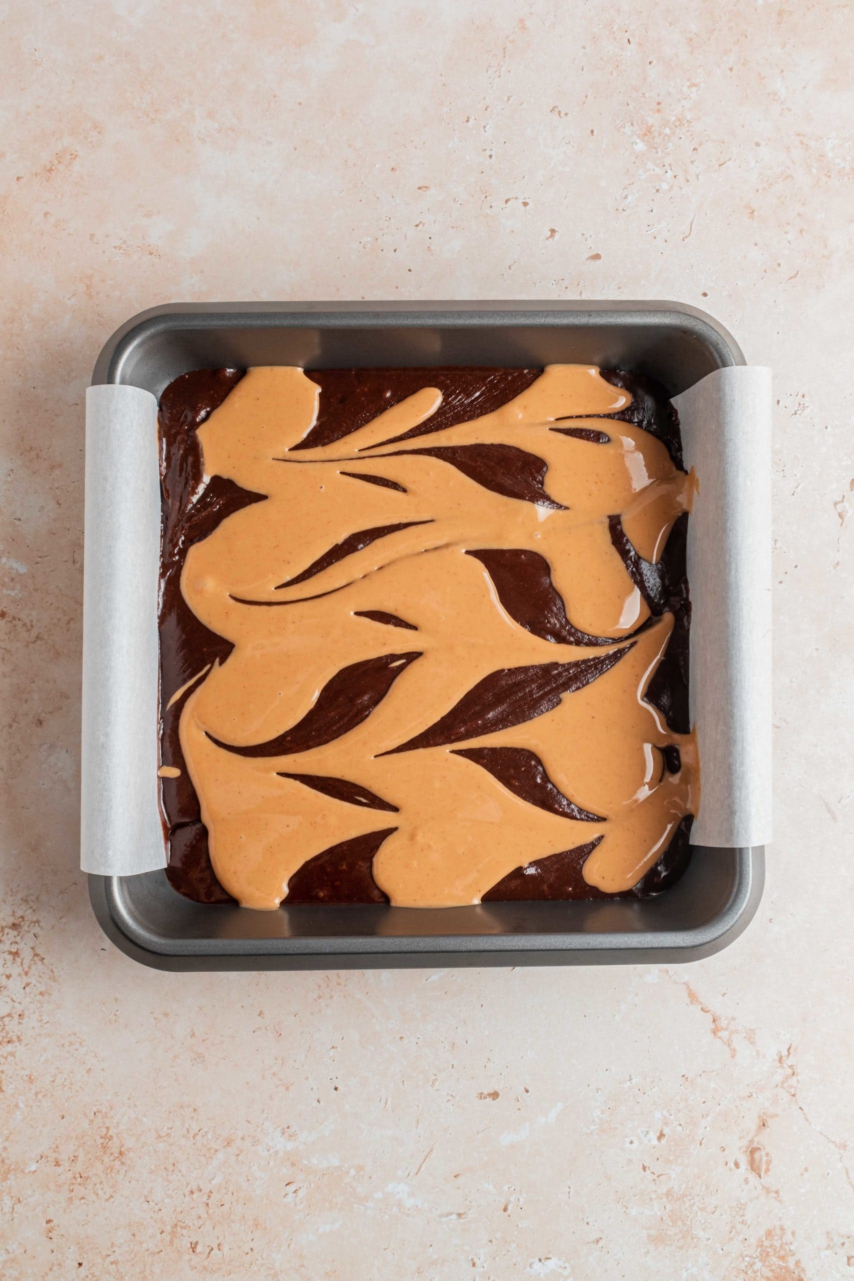 brownie batter with peanut butter swirl in tin