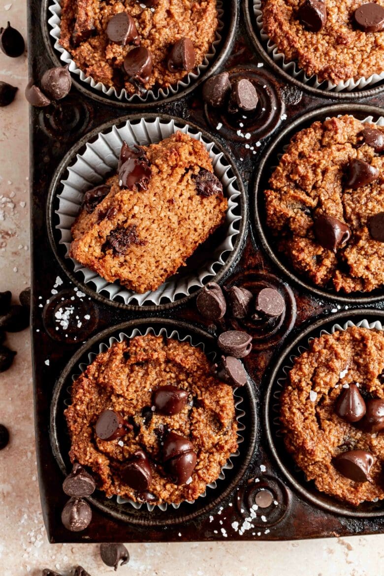 almond flour pumpkin muffins in tin with chocolate chips