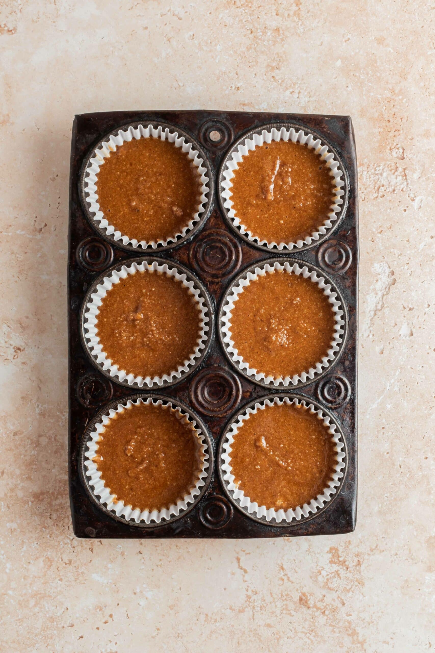 unbaked muffins in tin