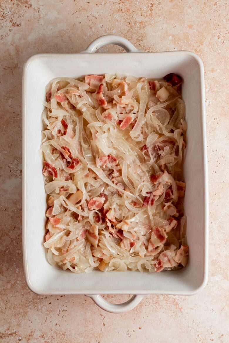 sauteed bacon and onions in baking dish