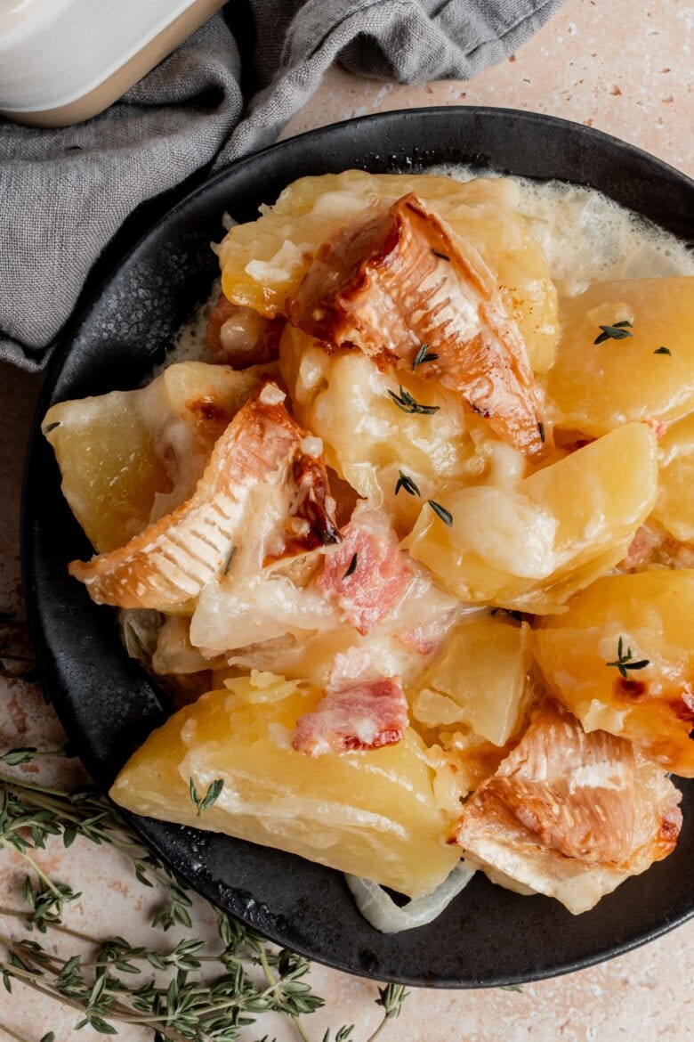 plate of creamy potatoes, onions, bacon and cheese
