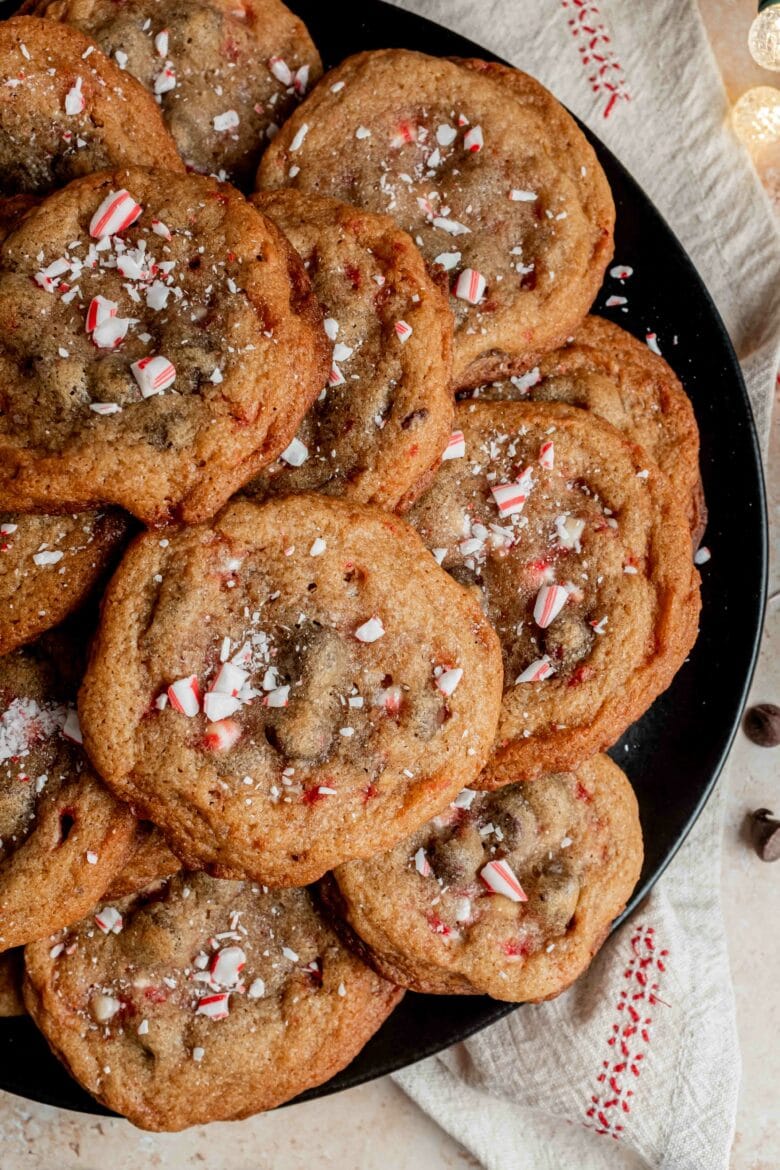 golden brown cookies sprinkled with crushed candy canes on a platter