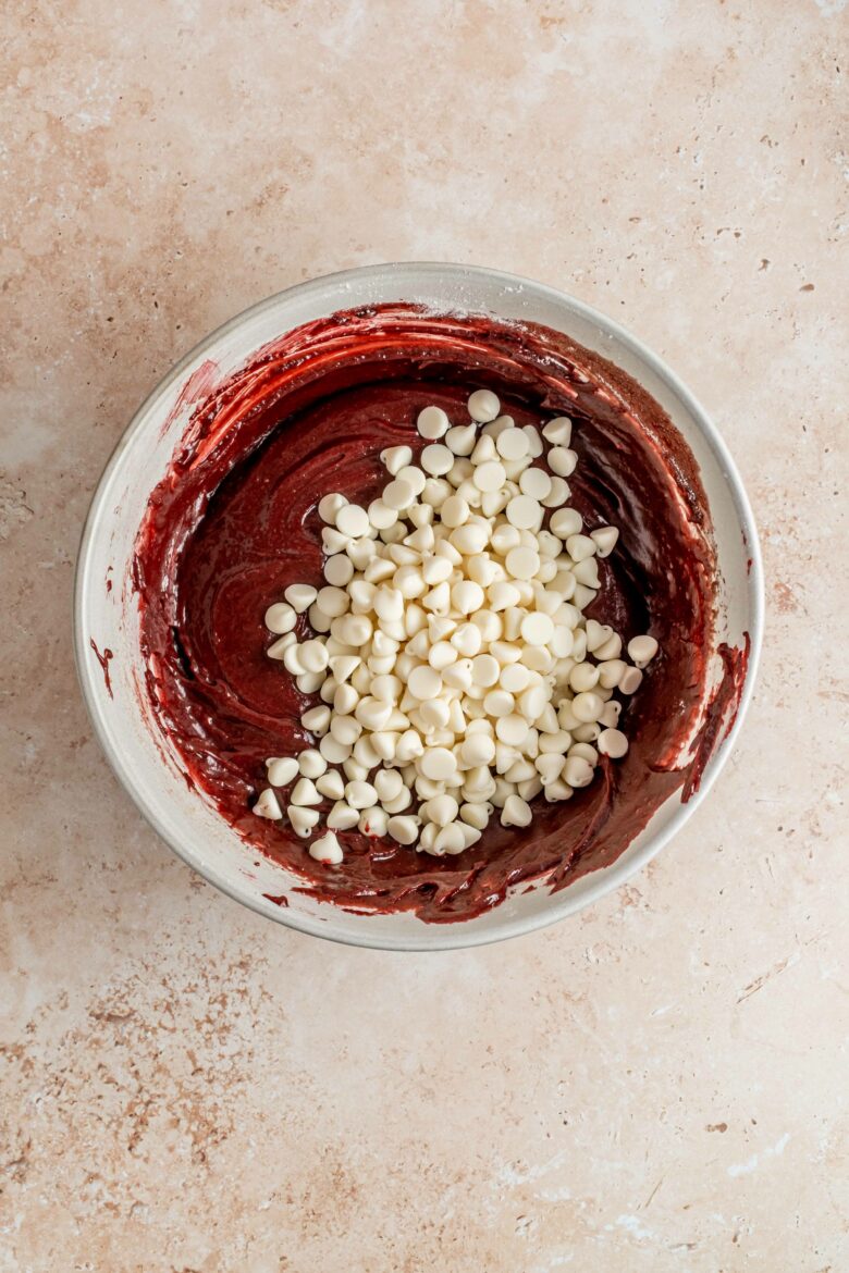 brownie batter in bowl with white chocolate chips