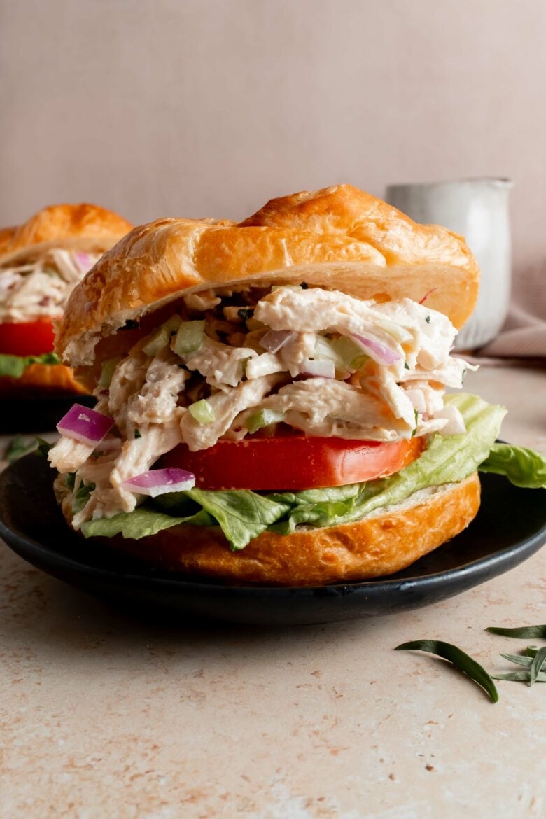 croissant sandwich with chicken salad, lettuce and tomato