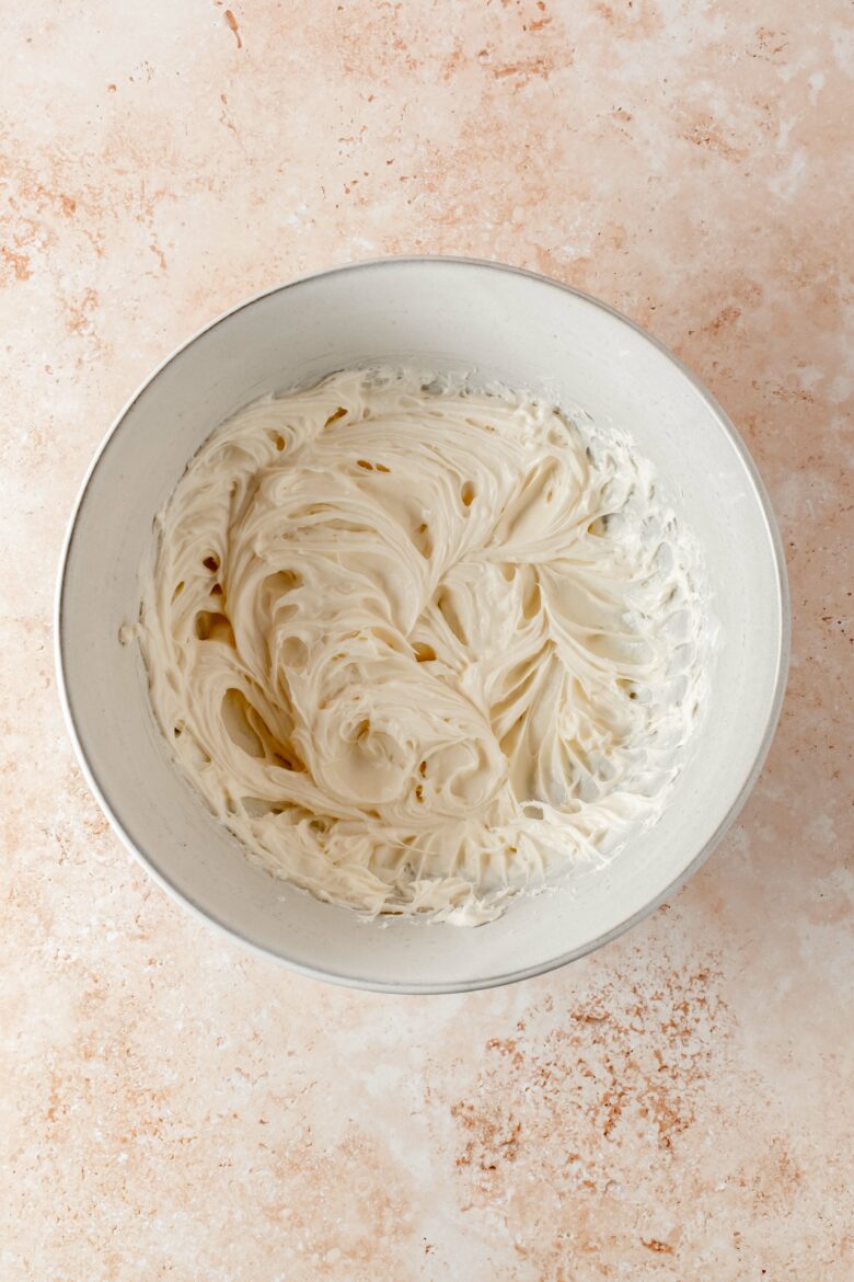 mixing the cream cheese with sugar