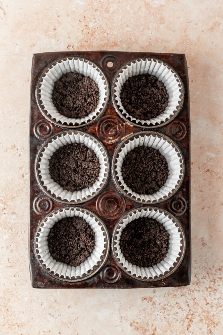 tin with cupcake liners and oreo crust