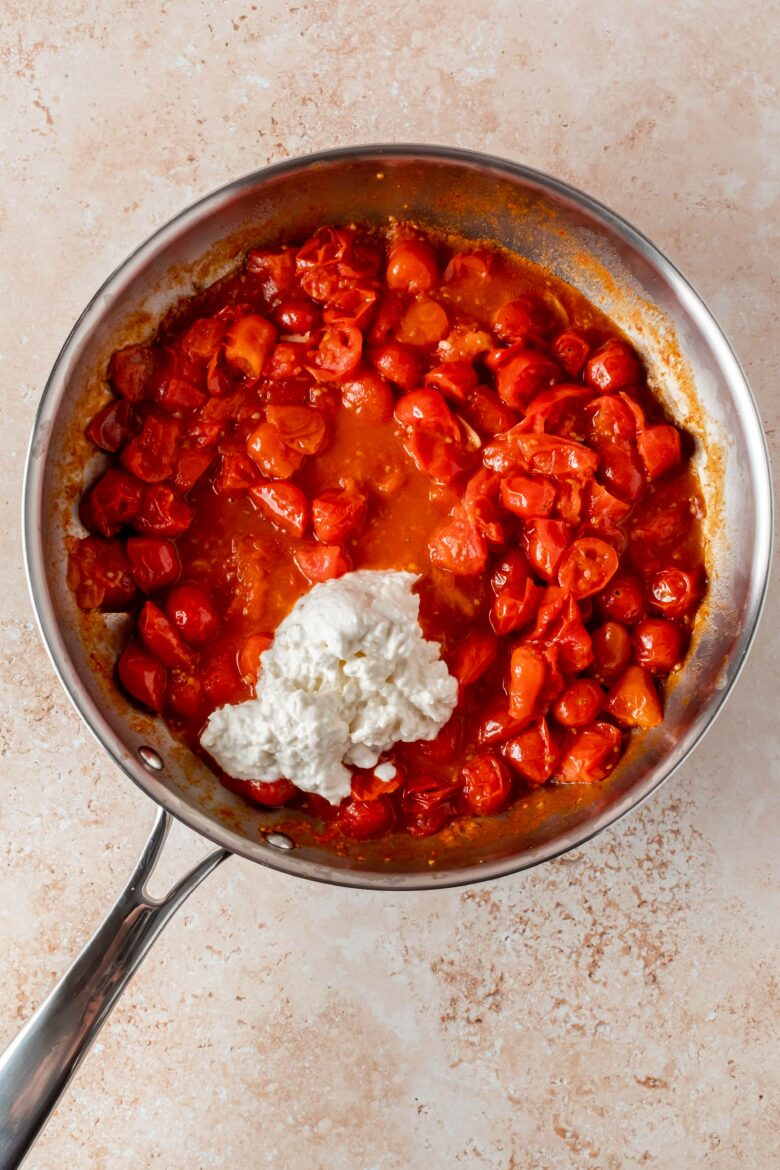 tomato sauce with the creamy part of burrata in skillet