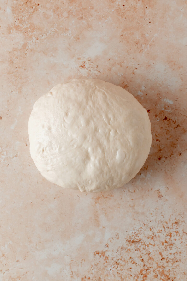 Pizza dough formed into ball