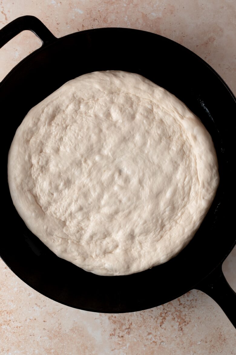Dough fully stretched in skillet