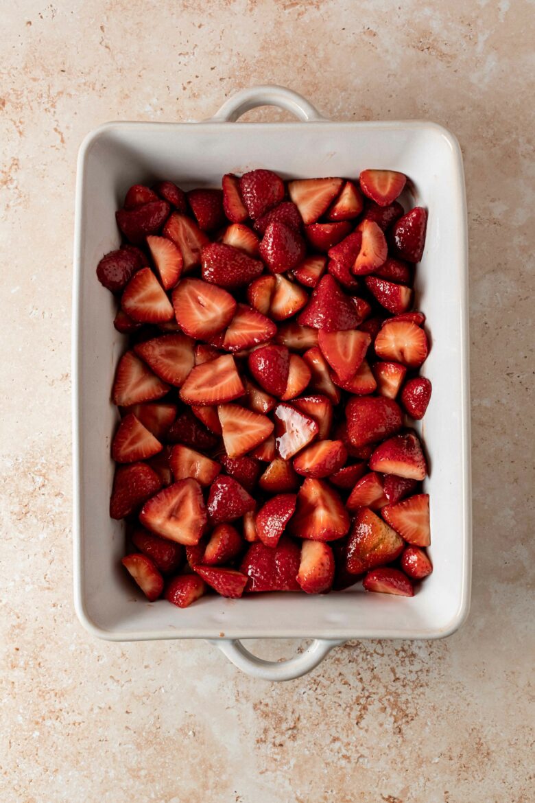 halved strawberries in baking dish