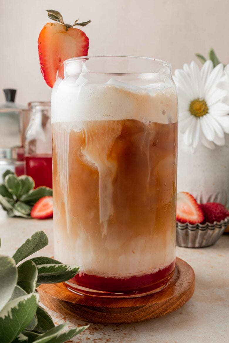 strawberry latte in a glass with ice