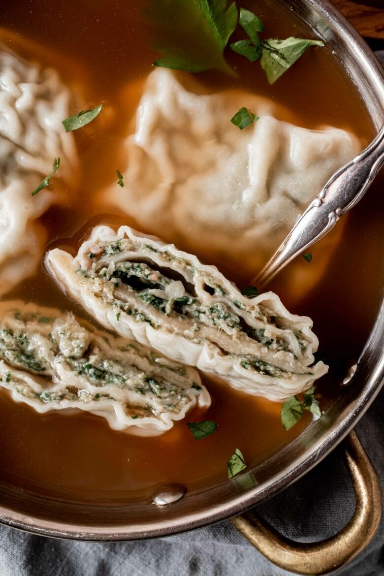 maultaschen cut open to see rolled pasta with filling